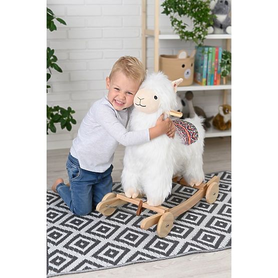 Alpaga sur cheval à bascule avec roulettes