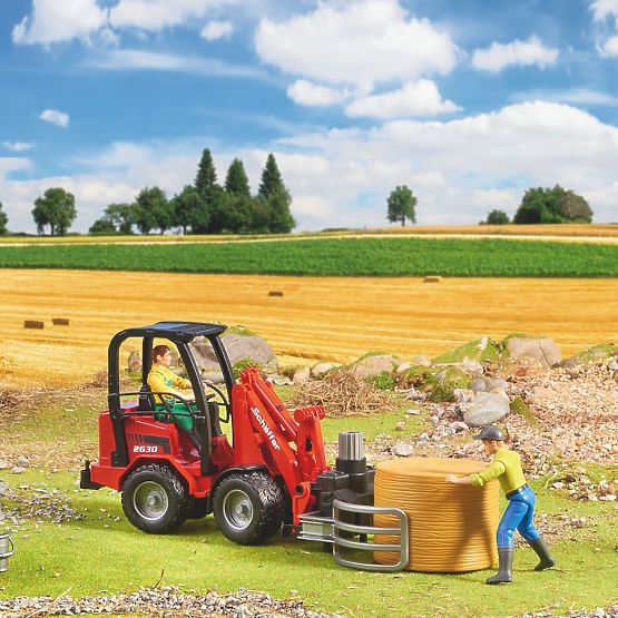 Chargeur frontal Bruder Schäffer avec pinces pour la manipulation des balles